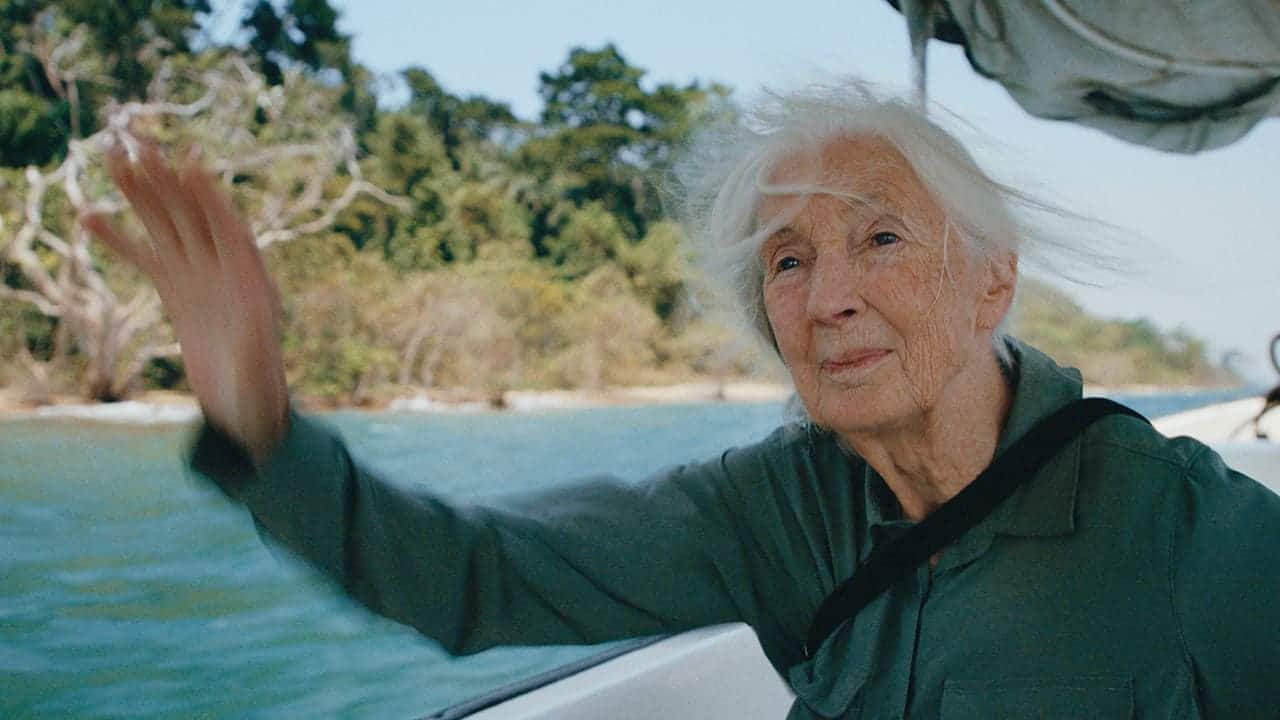 V1 0005 Jane waving from boat at lakeshore A088C726